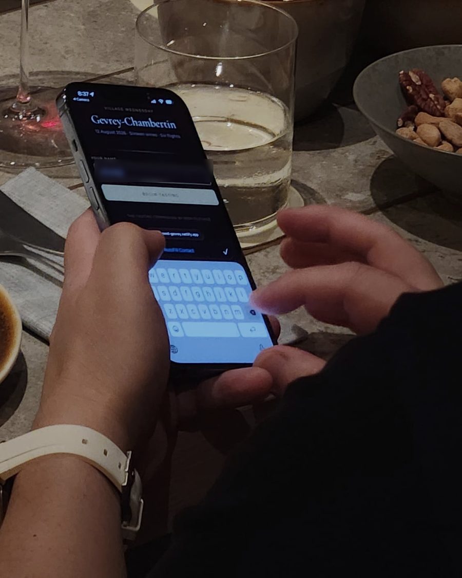 A guest joining a tasting on their phone at the table